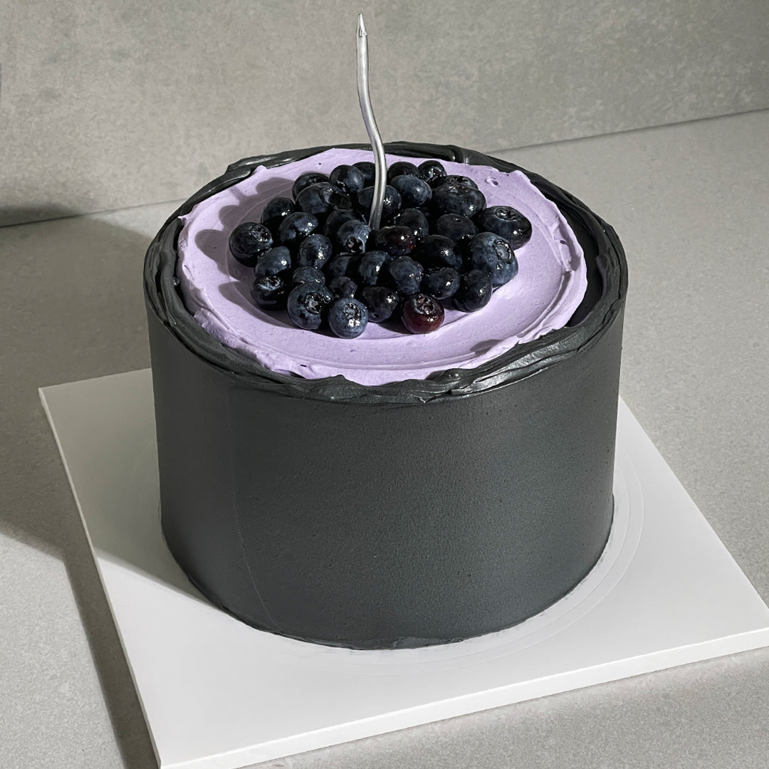 C18. Buttercream Blueberry Black Icing Cake
